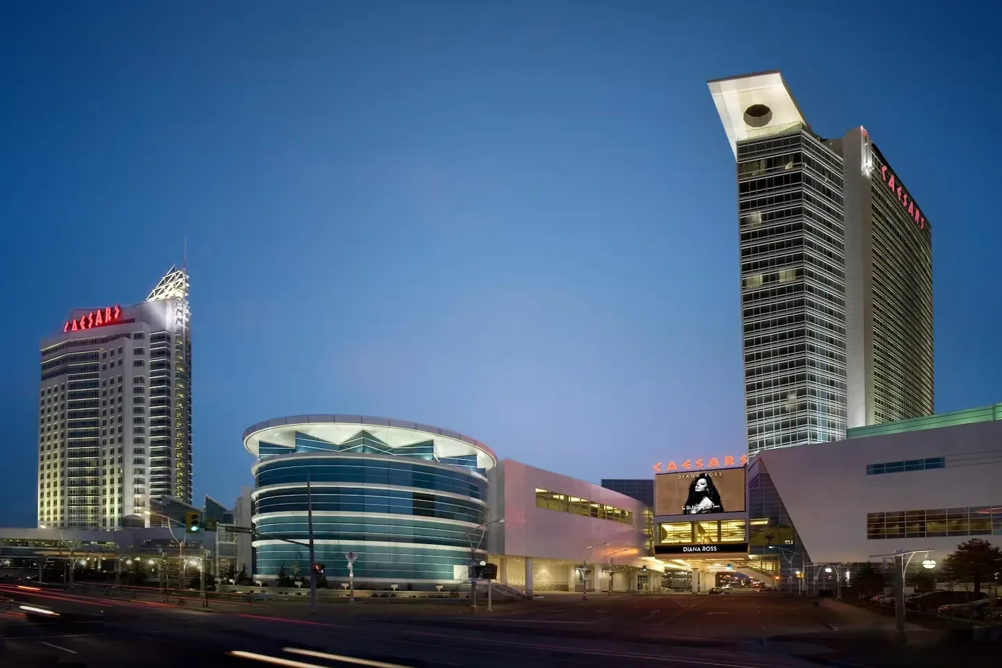 Hotel facade at dusk along the waterfront